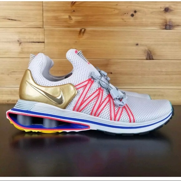 nike shox gravity metallic gold